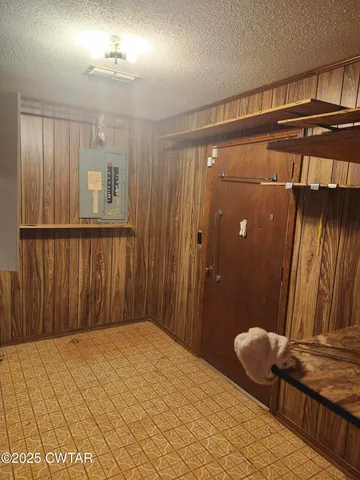 a bedroom with a bed and a mirror