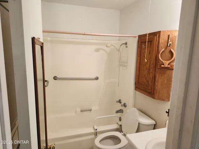 a bathroom with a tub and a sink
