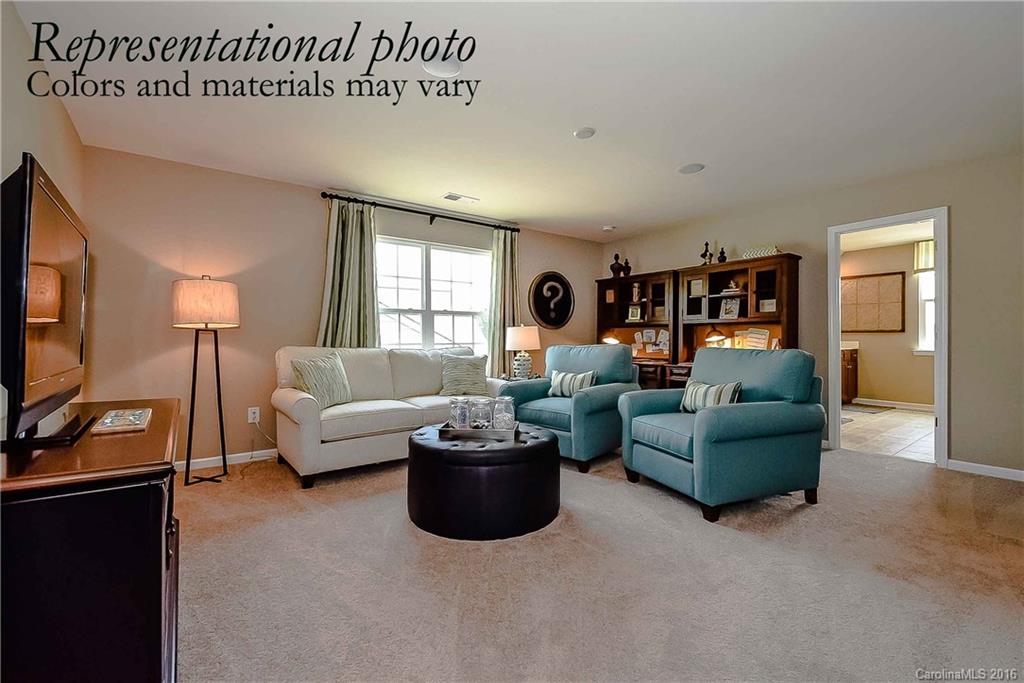 79169 Ridgehaven Road, Unit 152 Lancaster, SC 29720 - Photo 5 of 9 a living room with furniture and a flat screen tv
