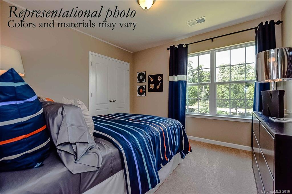 79169 Ridgehaven Road, Unit 152 Lancaster, SC 29720 - Photo 8 of 9 a bedroom with a bed and a window