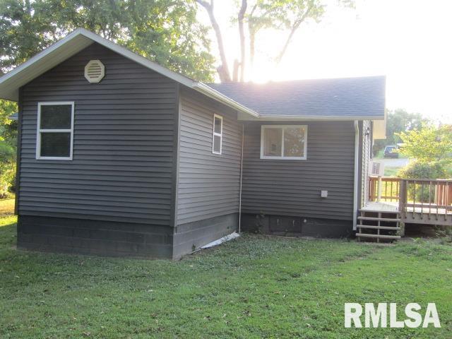 1506 Hillside Road Rosiclare, IL 62982 - Photo 2 of 29 a backyard of a house with lots of green space