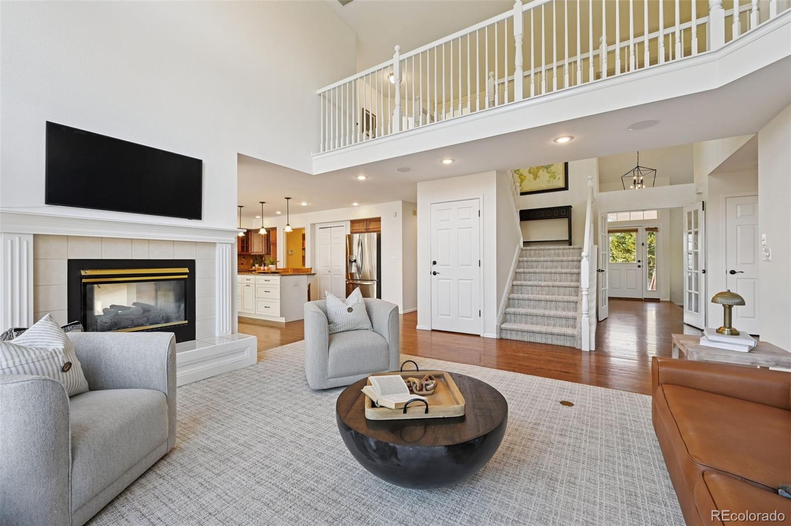 5575 Butler Court Colorado Springs, CO 80918 - Photo 11 of 47 a living room with furniture and a fireplace