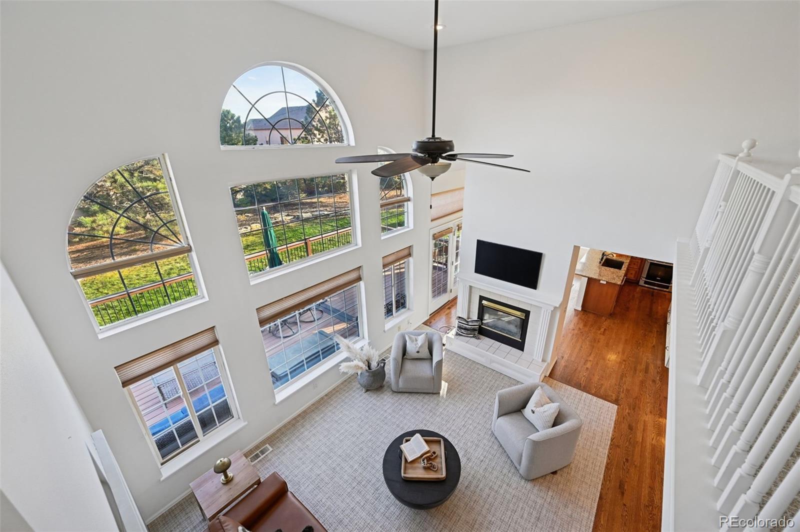 5575 Butler Court Colorado Springs, CO 80918 - Photo 27 of 47 a living room with furniture and a flat screen tv