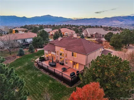 an aerial view of a house with mountain view