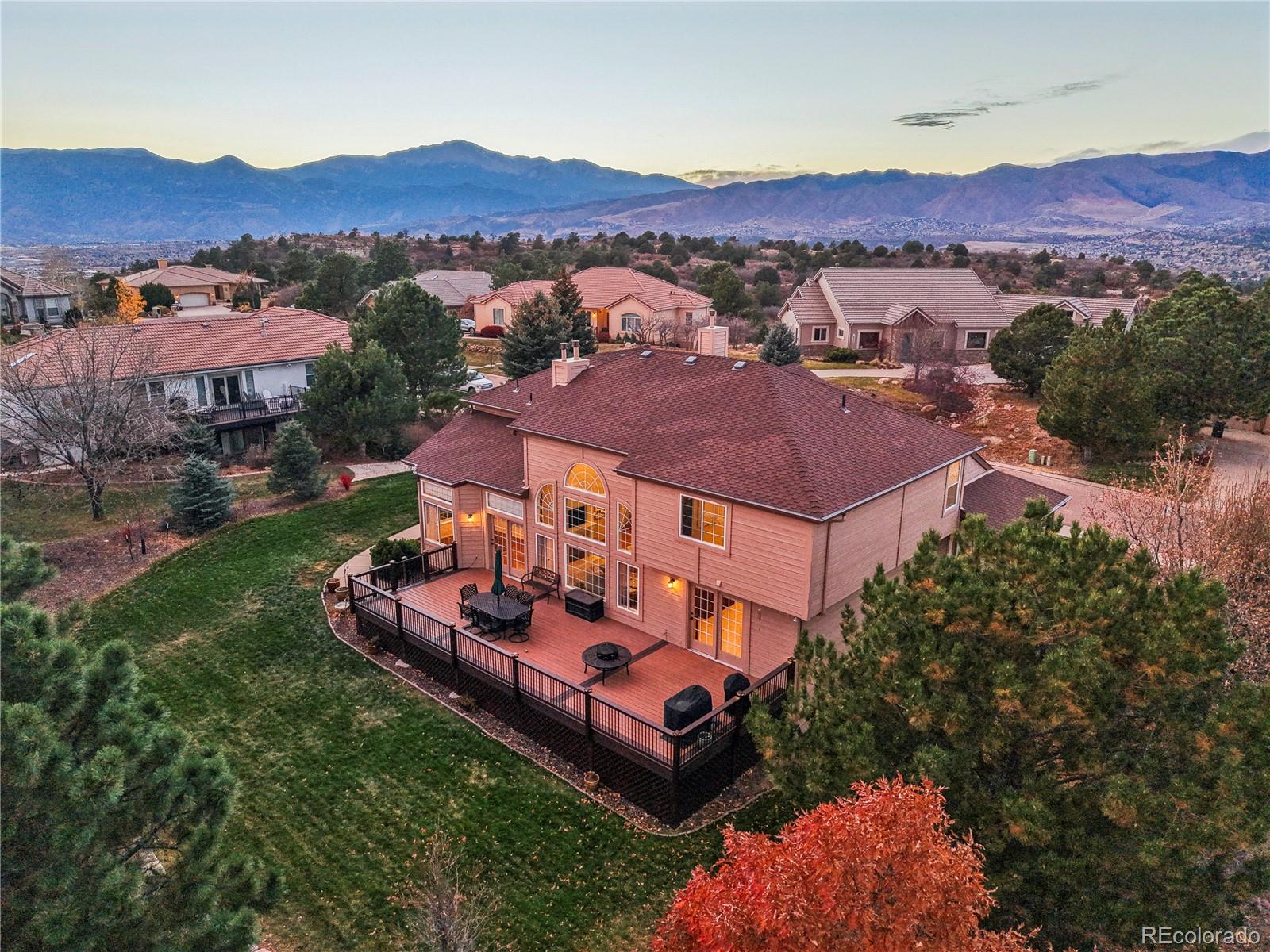 5575 Butler Court Colorado Springs, CO 80918 - Photo 39 of 47 an aerial view of a house with mountain view