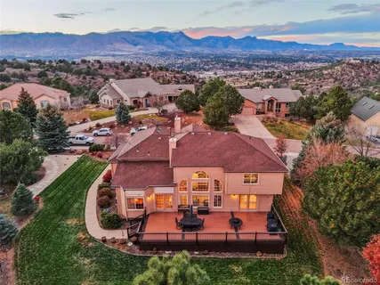 an aerial view of a house with pool