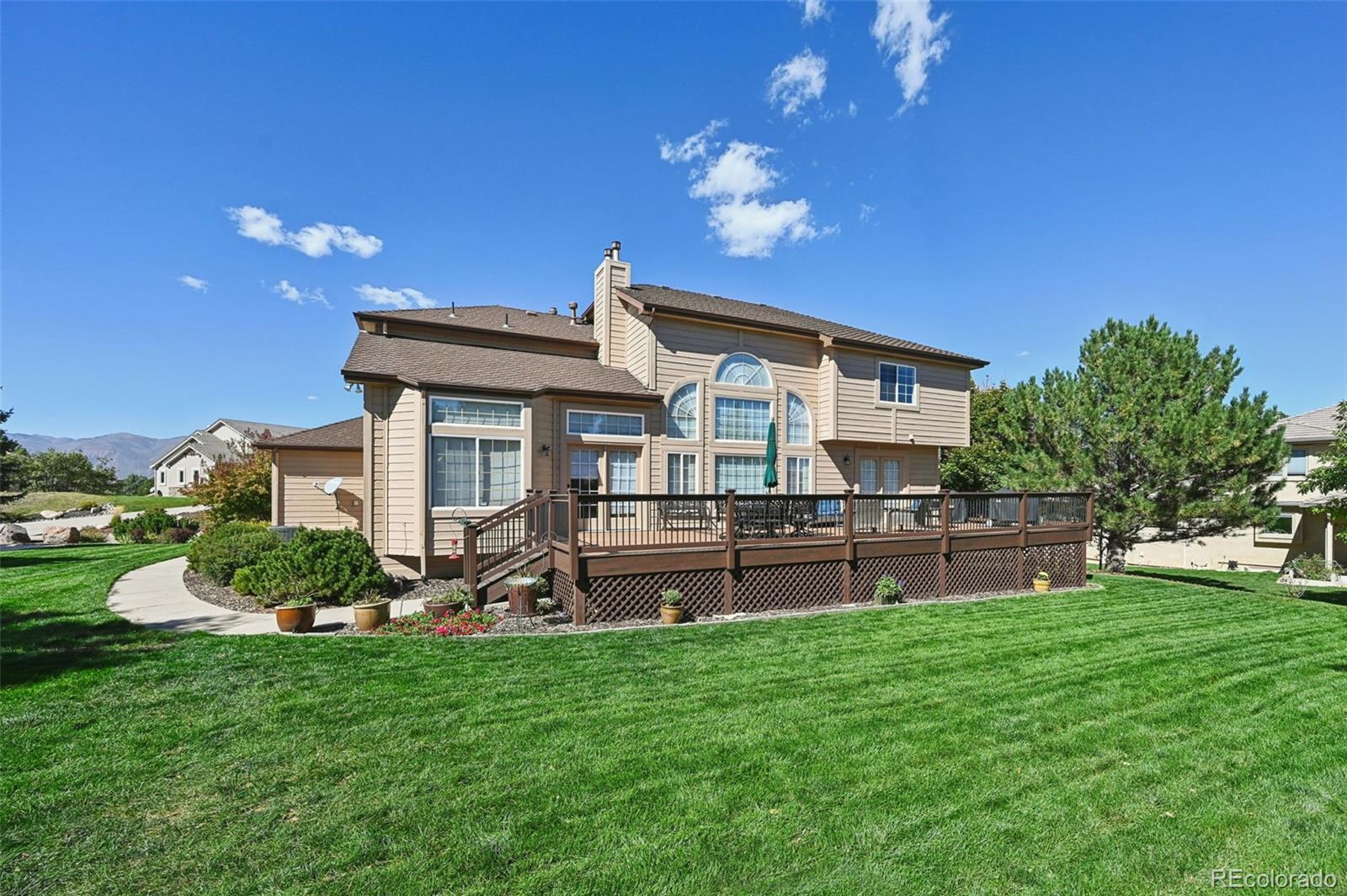 5575 Butler Court Colorado Springs, CO 80918 - Photo 43 of 47 a front view of a house with a garden