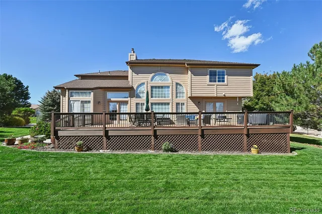 a view of a house with a backyard