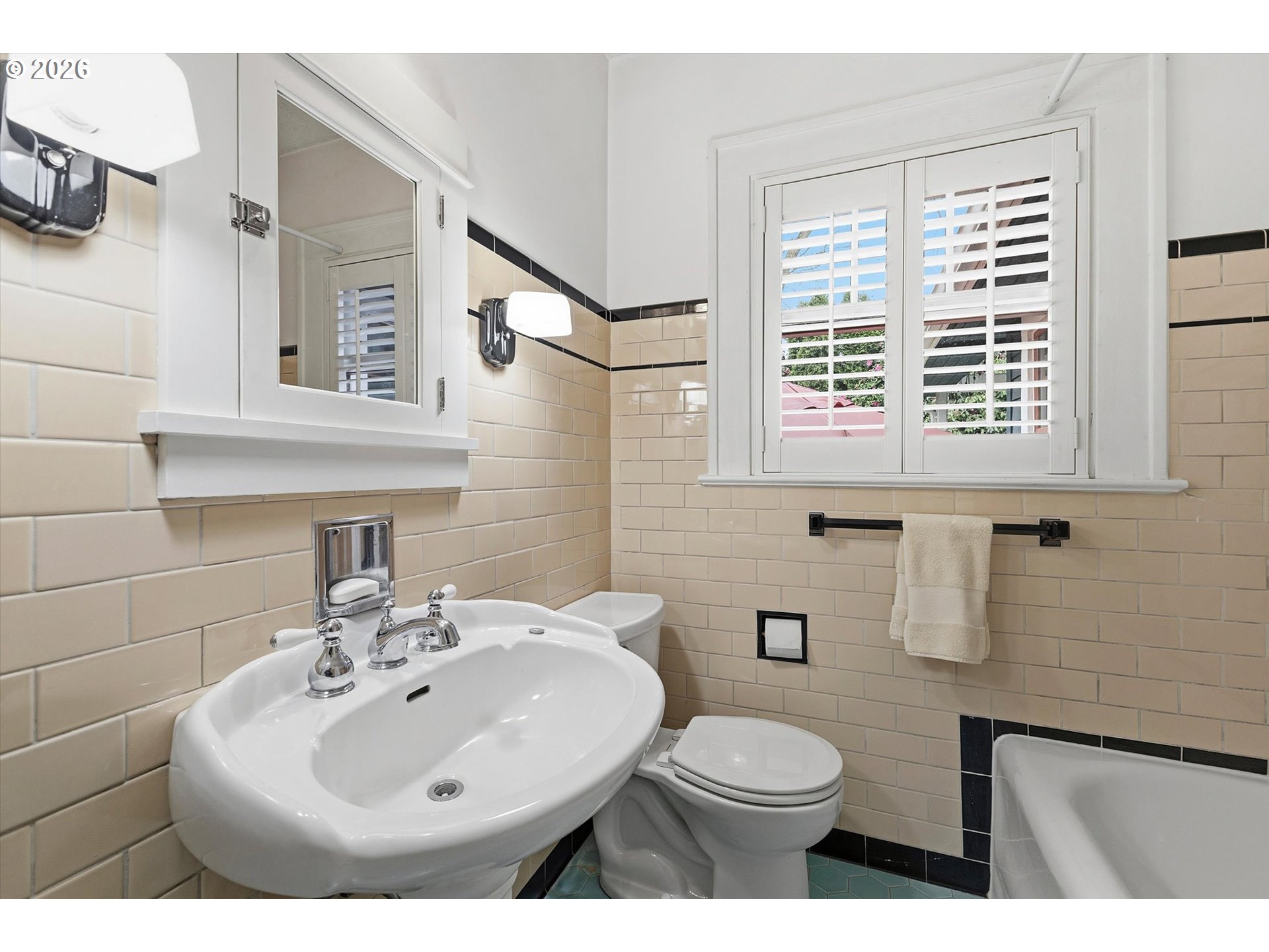 3613 Northeast 24th Avenue Portland, OR 97212 - Photo 14 of 48 a bathroom with a sink a toilet and mirror