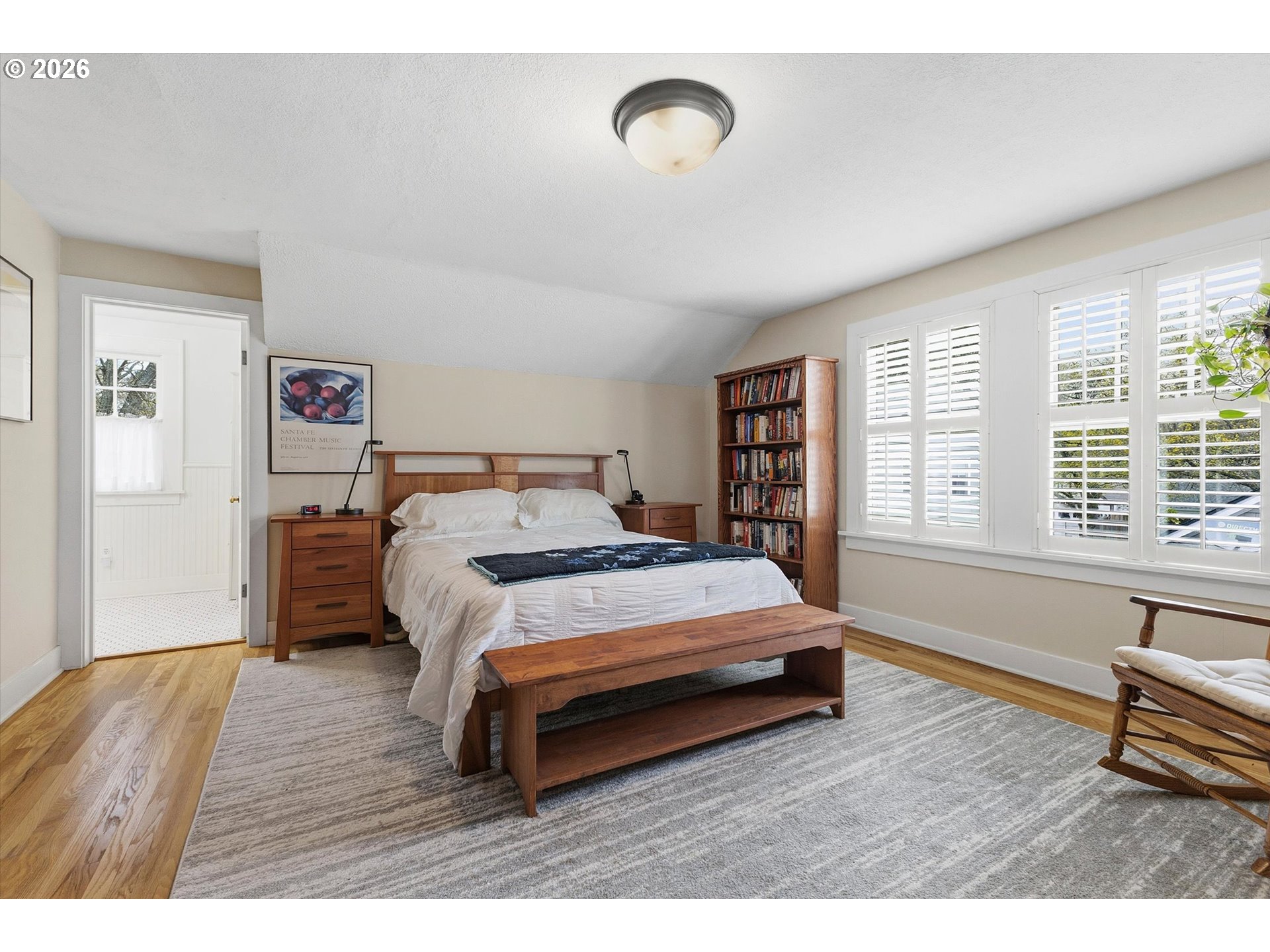 3613 Northeast 24th Avenue Portland, OR 97212 - Photo 21 of 48 a bedroom with a bed and a large window