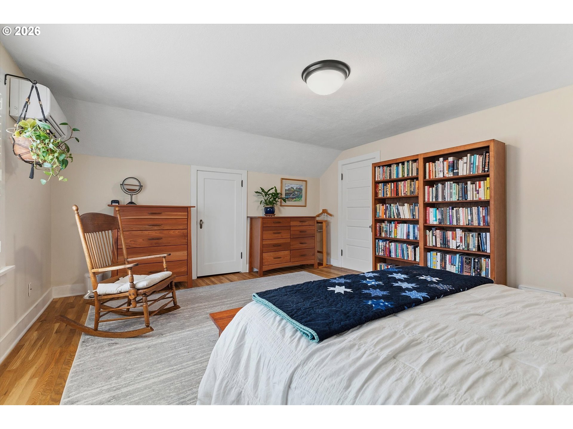 3613 Northeast 24th Avenue Portland, OR 97212 - Photo 23 of 48 a bedroom with a bed and a chair in it