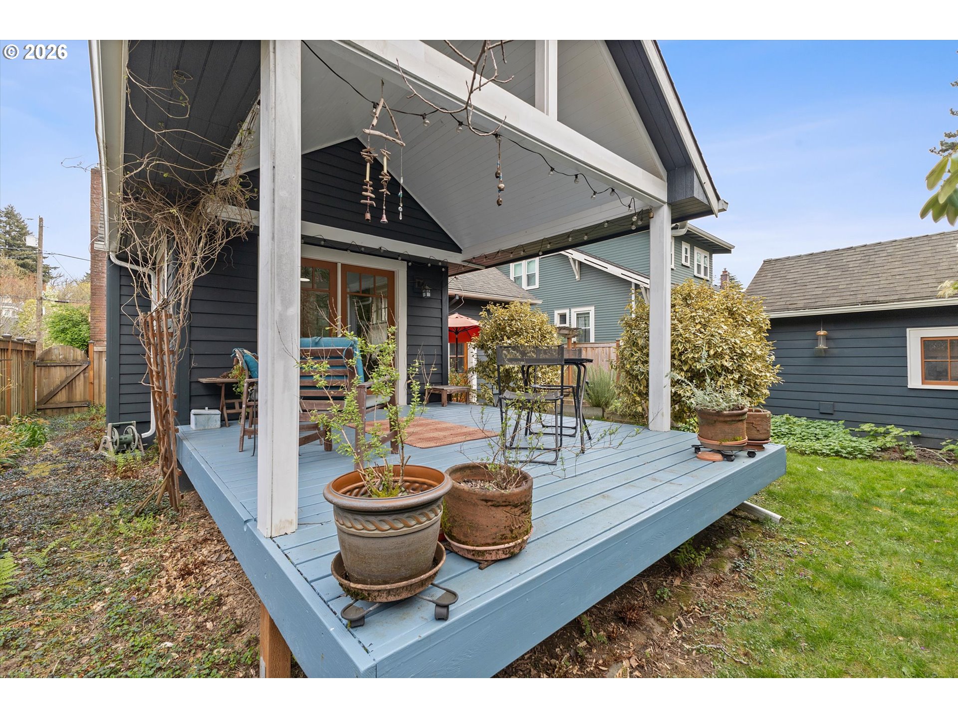 3613 Northeast 24th Avenue Portland, OR 97212 - Photo 34 of 48 a view of a patio with table and chairs potted plants with wooden floor
