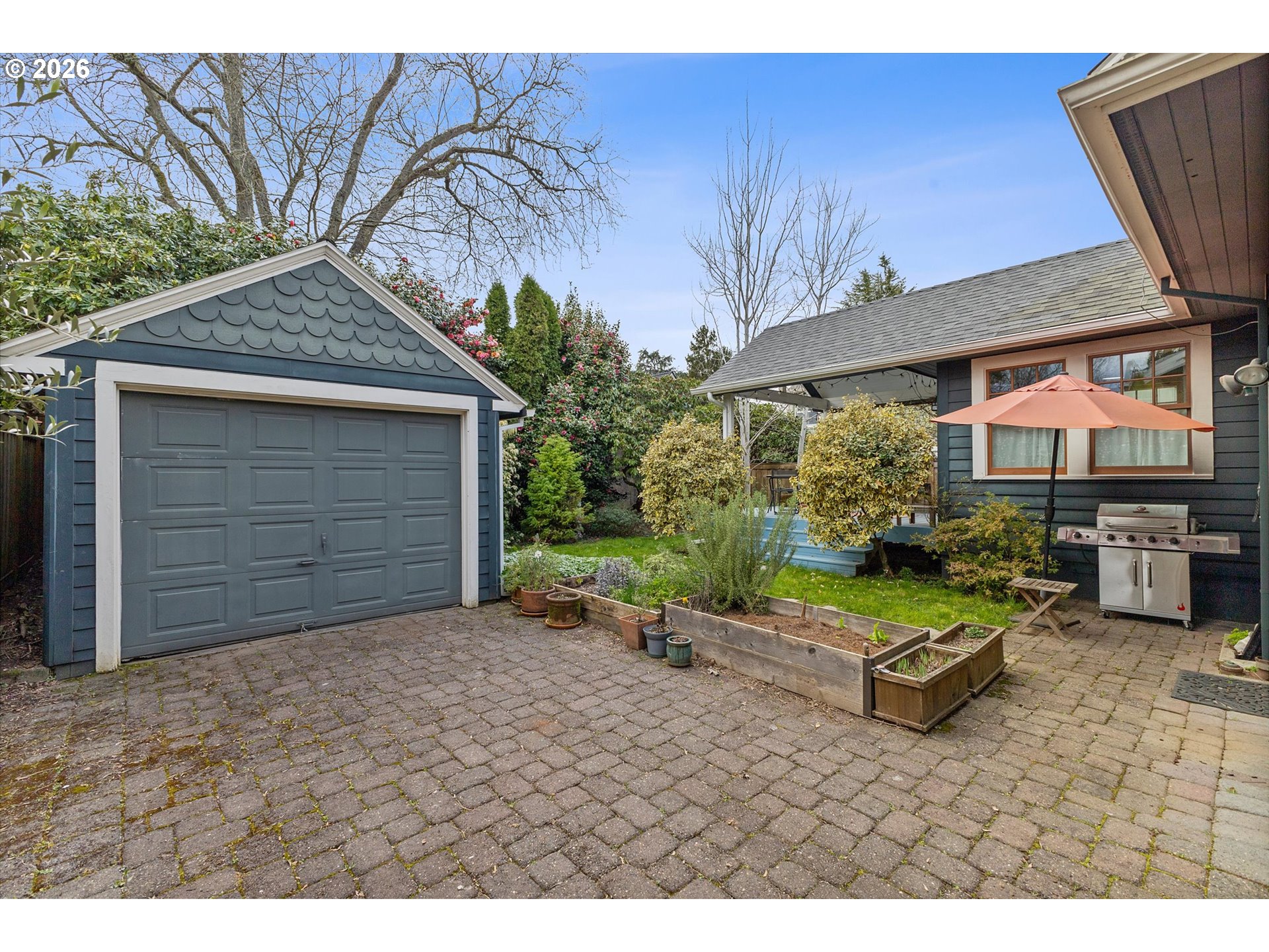 3613 Northeast 24th Avenue Portland, OR 97212 - Photo 41 of 48 a backyard of a house with barbeque oven table and chairs