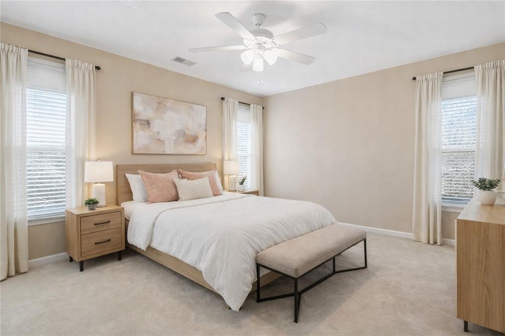 112 Willow View Lane Canton, GA 30114 - Photo 20 of 50 a spacious bedroom with a bed and a window