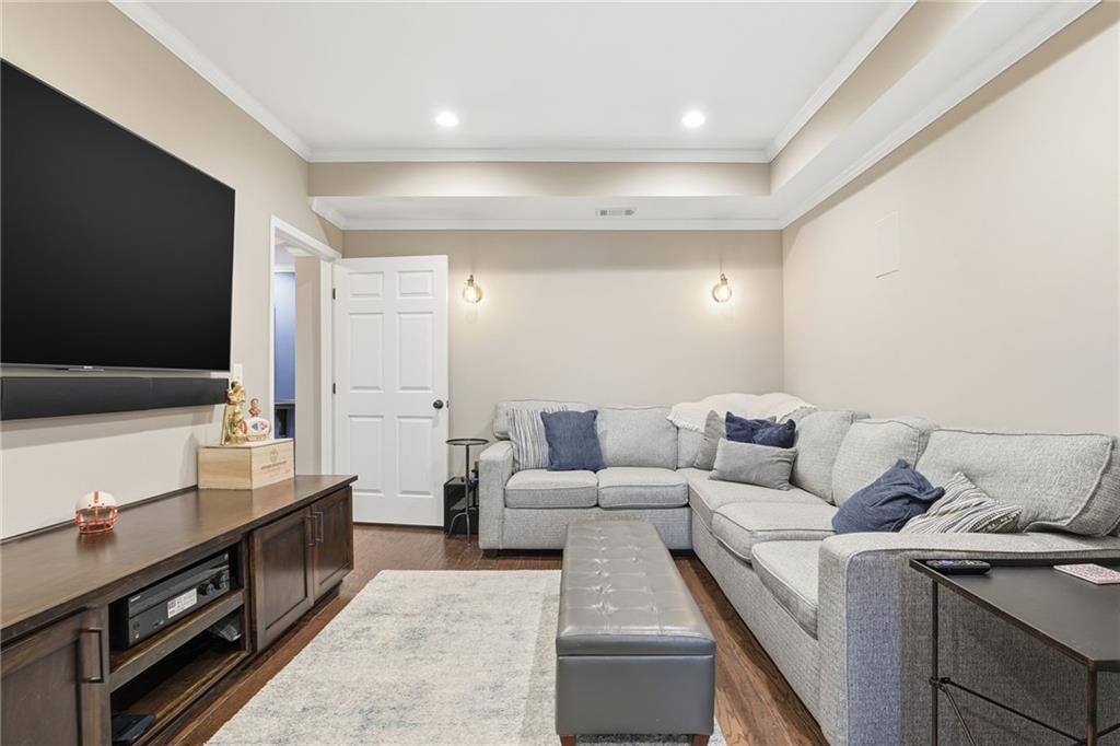 112 Willow View Lane Canton, GA 30114 - Photo 37 of 50 a living room with furniture and a flat screen tv