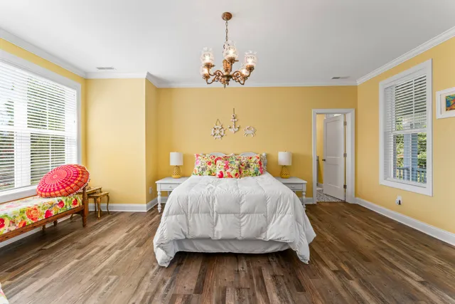 a room with furniture pool table and window