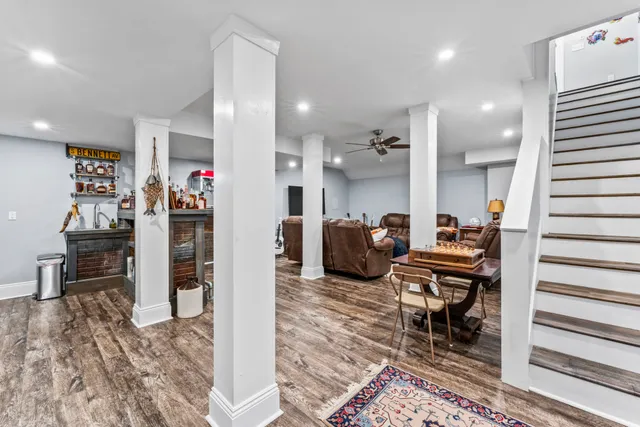 a view of a house with a yard deck and sitting area