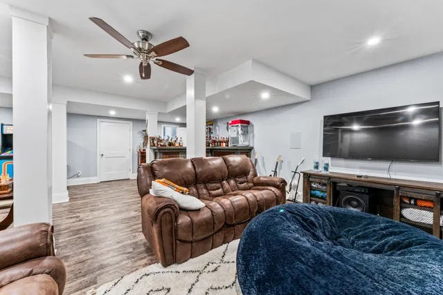 an aerial view of a house with yard and outdoor seating