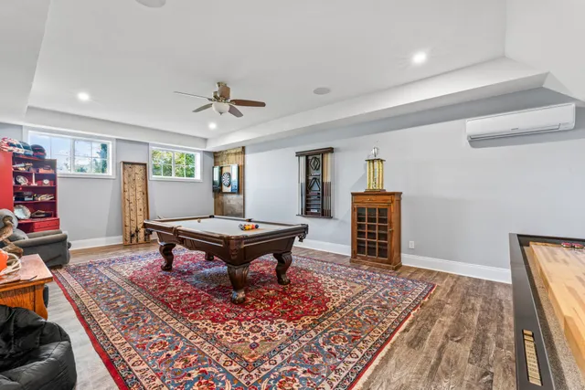 an aerial view of residential house with outdoor space and lake view