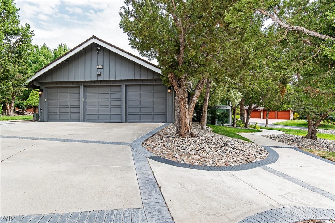 4125 Powderkeg Circle Reno, NV 89519 - Photo 11 of 11 a front view of a house with a garden