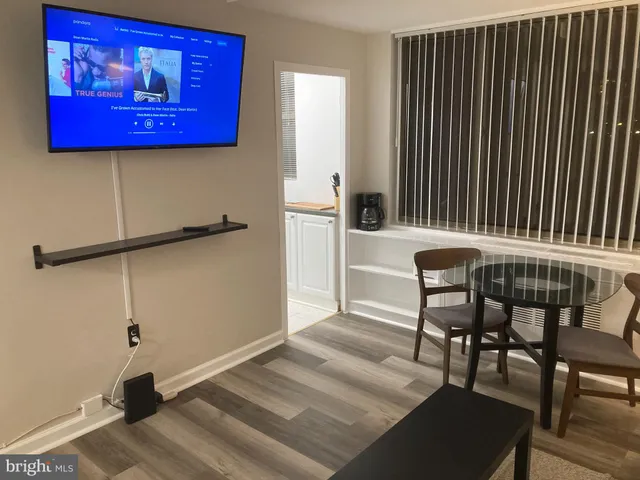 a bedroom with a bed and a mirror