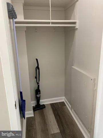 a room with a window and wooden floor