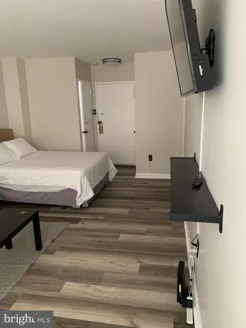 a bedroom with a bed and cabinets