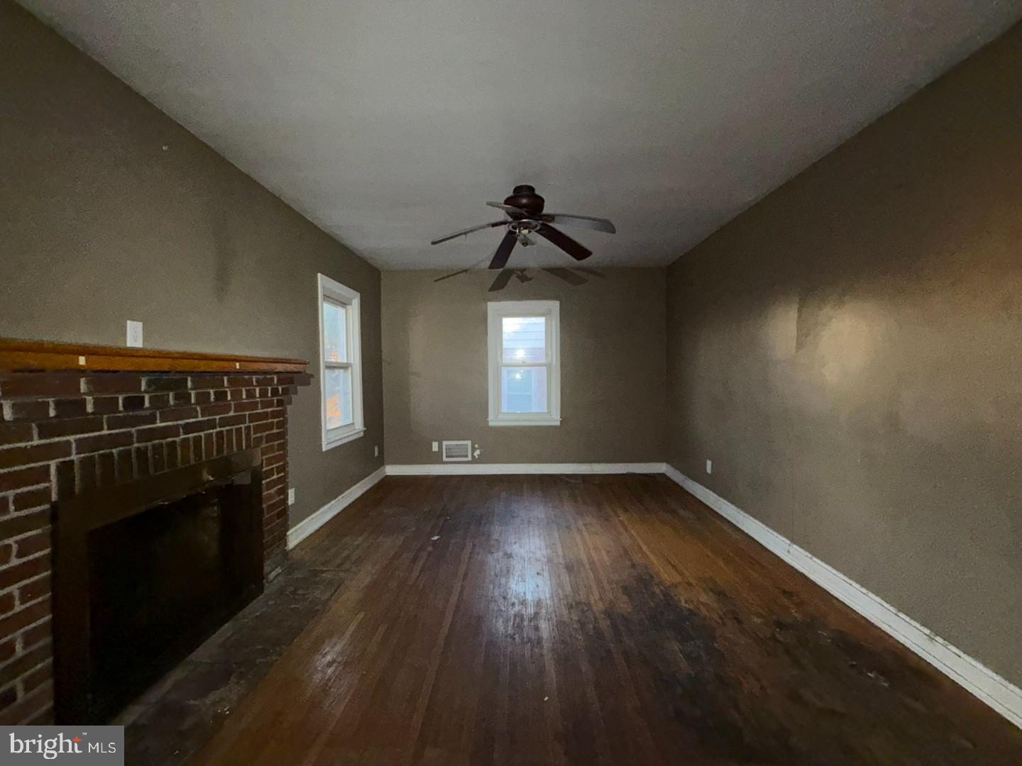 27 Haines Avenue Rising Sun, MD 21911 - Photo 4 of 32 a view of empty room with wooden floor and fireplace