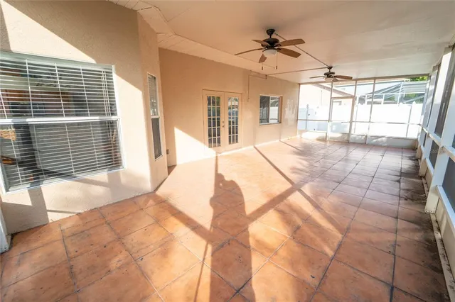 a view of a bedroom with a large windows