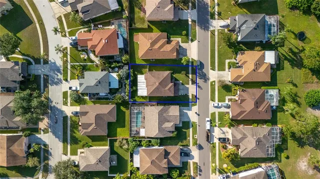 an aerial view of multiple houses with outdoor space