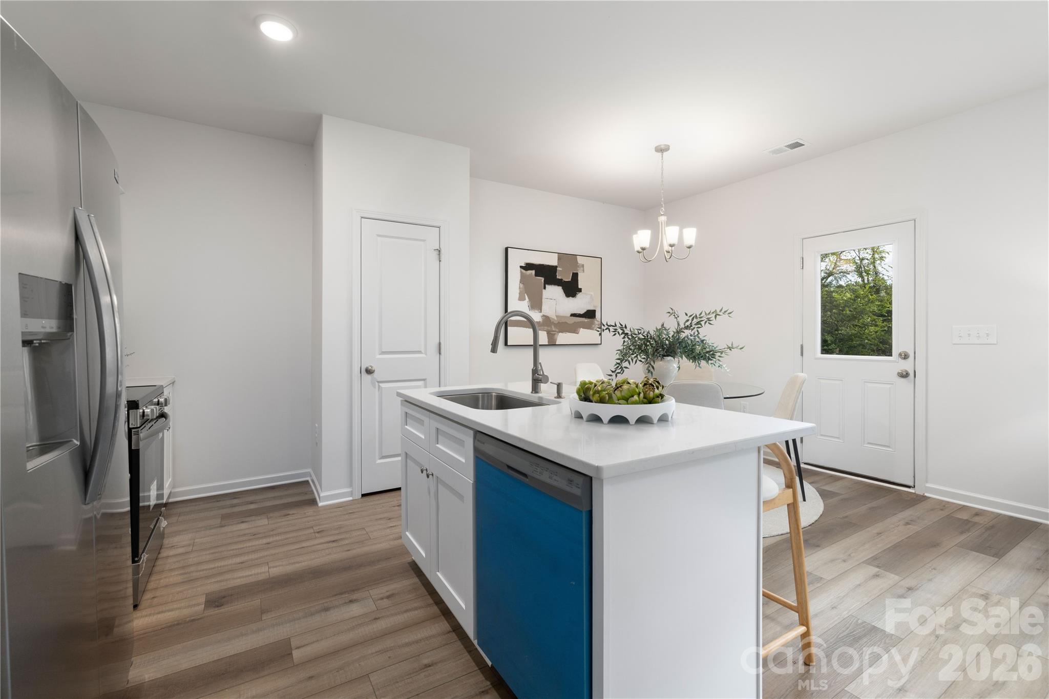 6924 Ridge Ln Road Charlotte, NC 28262 - Photo 11 of 24 a kitchen with a sink and refrigerator