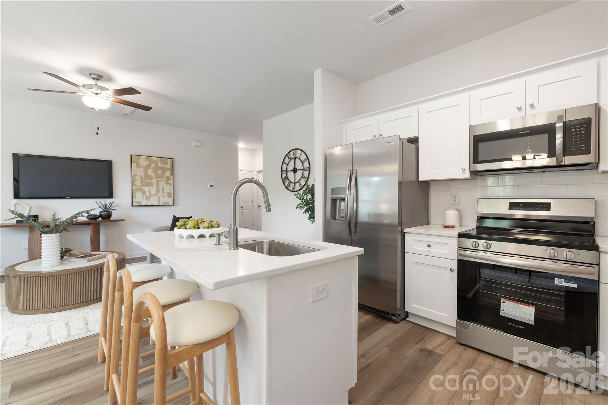 6924 Ridge Ln Road Charlotte, NC 28262 - Photo 13 of 24 a kitchen with stainless steel appliances granite countertop a stove a sink and a microwave
