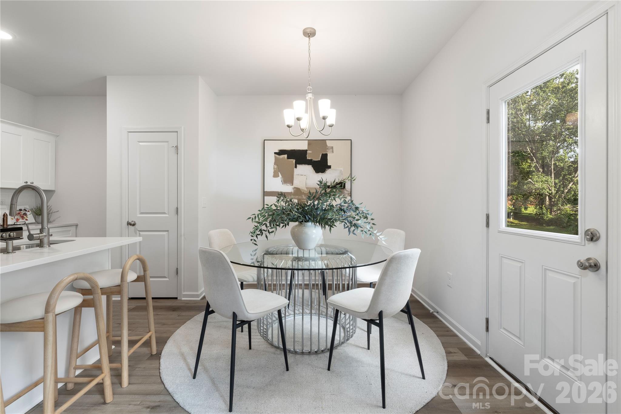 6924 Ridge Ln Road Charlotte, NC 28262 - Photo 14 of 24 a dining room with furniture a chandelier and window