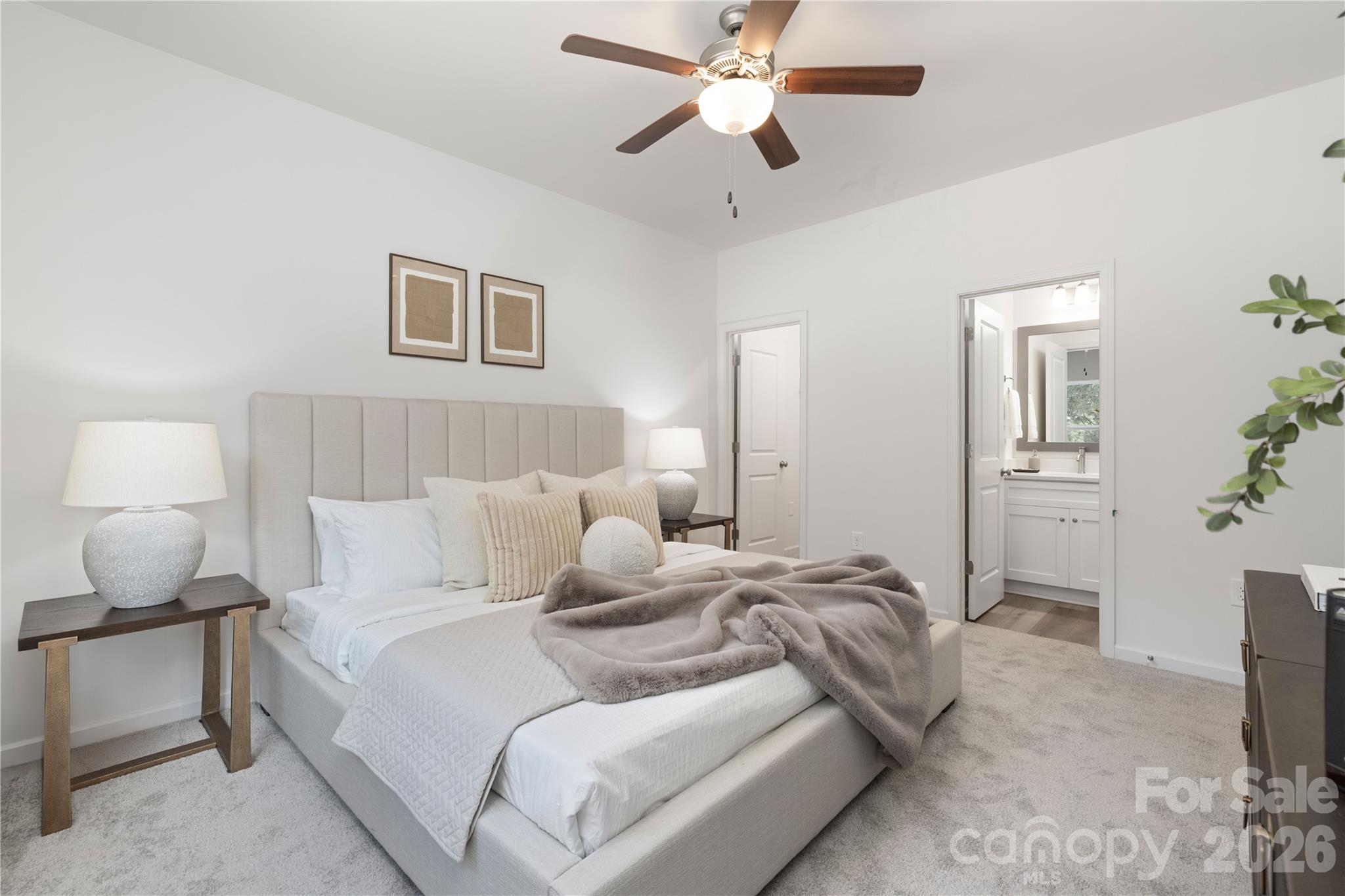 6924 Ridge Ln Road Charlotte, NC 28262 - Photo 16 of 24 a bedroom with a bed and a lamp on the dresser