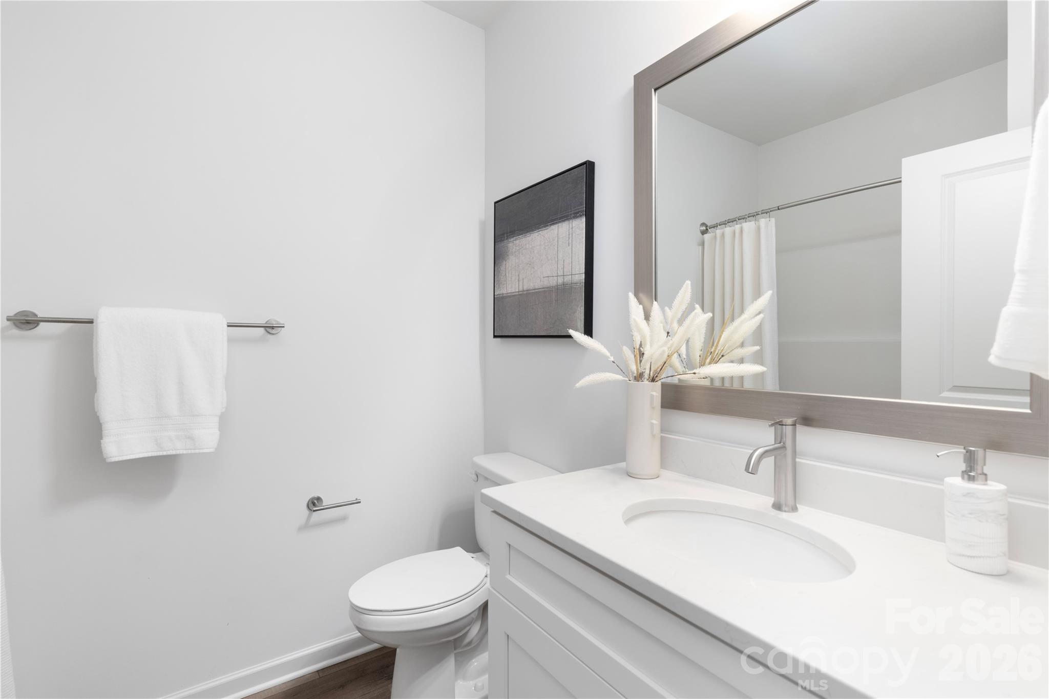 6924 Ridge Ln Road Charlotte, NC 28262 - Photo 19 of 24 a bathroom with a sink toilet and mirror