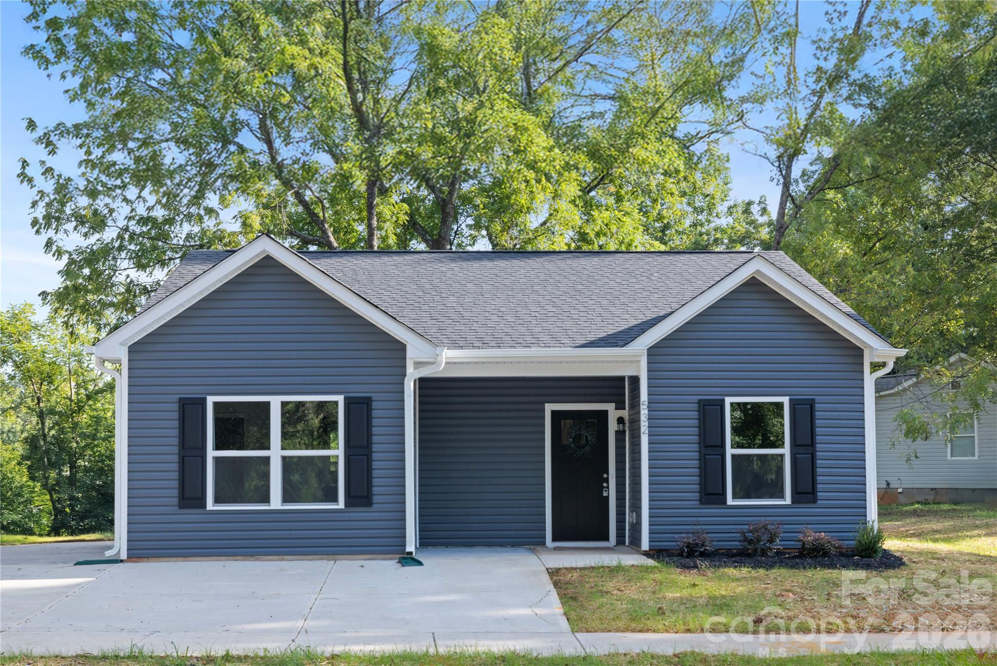 6924 Ridge Ln Road Charlotte, NC 28262 - Photo 2 of 24 front view of a house with a yard