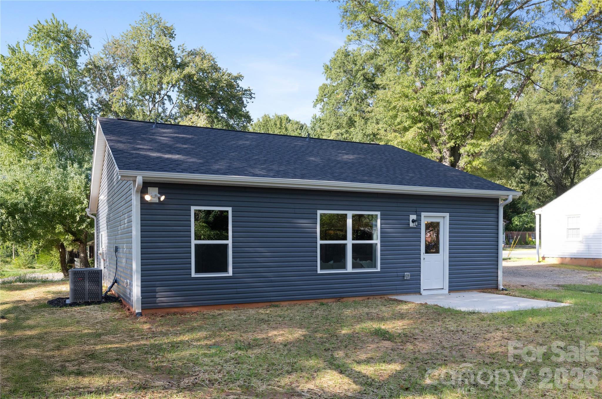 6924 Ridge Ln Road Charlotte, NC 28262 - Photo 23 of 24 a front view of a house with a garden