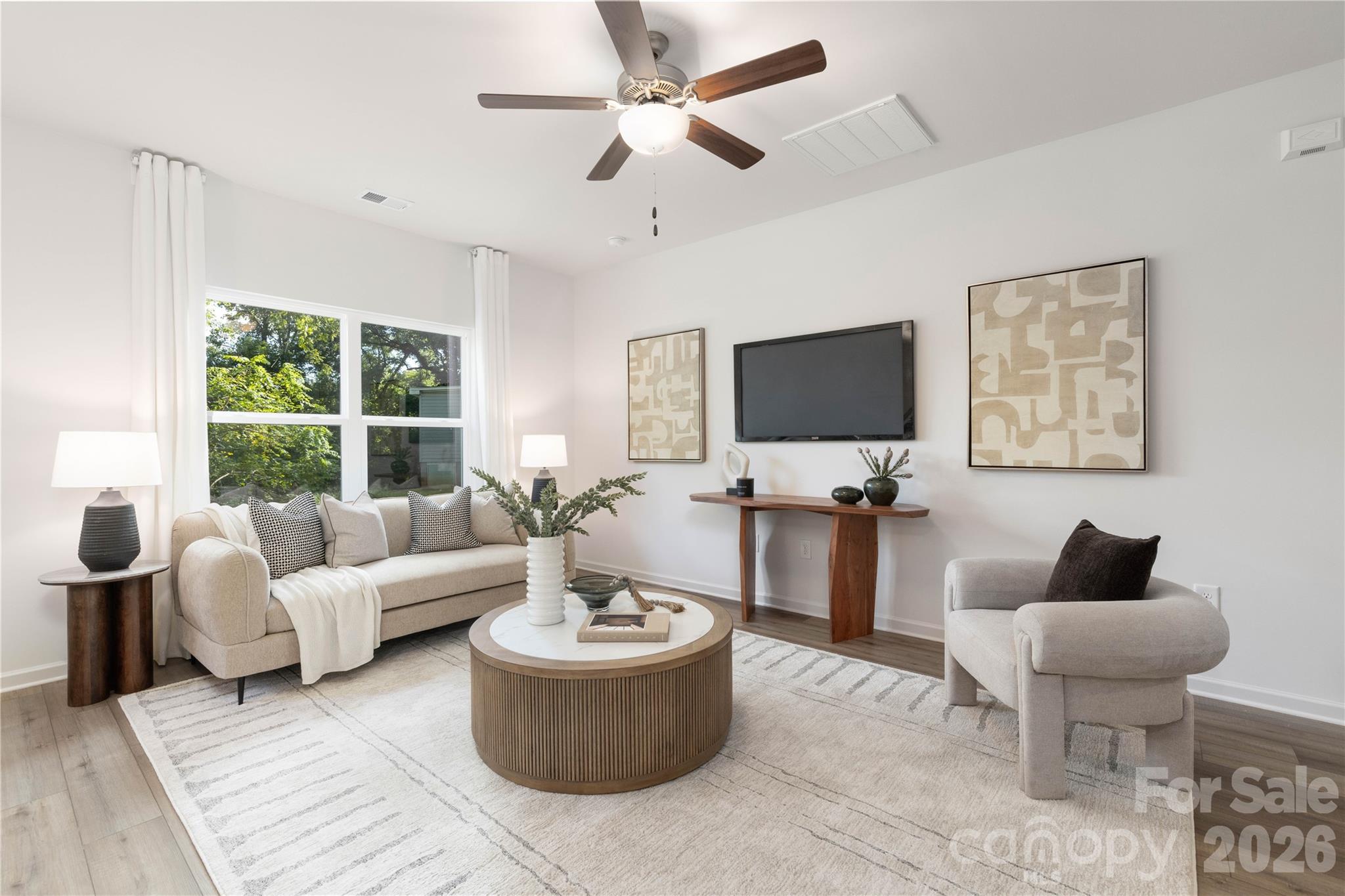 6924 Ridge Ln Road Charlotte, NC 28262 - Photo 7 of 24 a living room with furniture and a flat screen tv