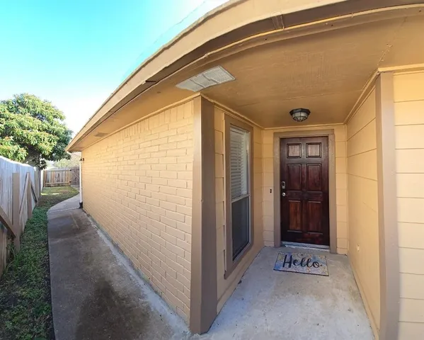 a view of a kitchen with a sink and a fireplace