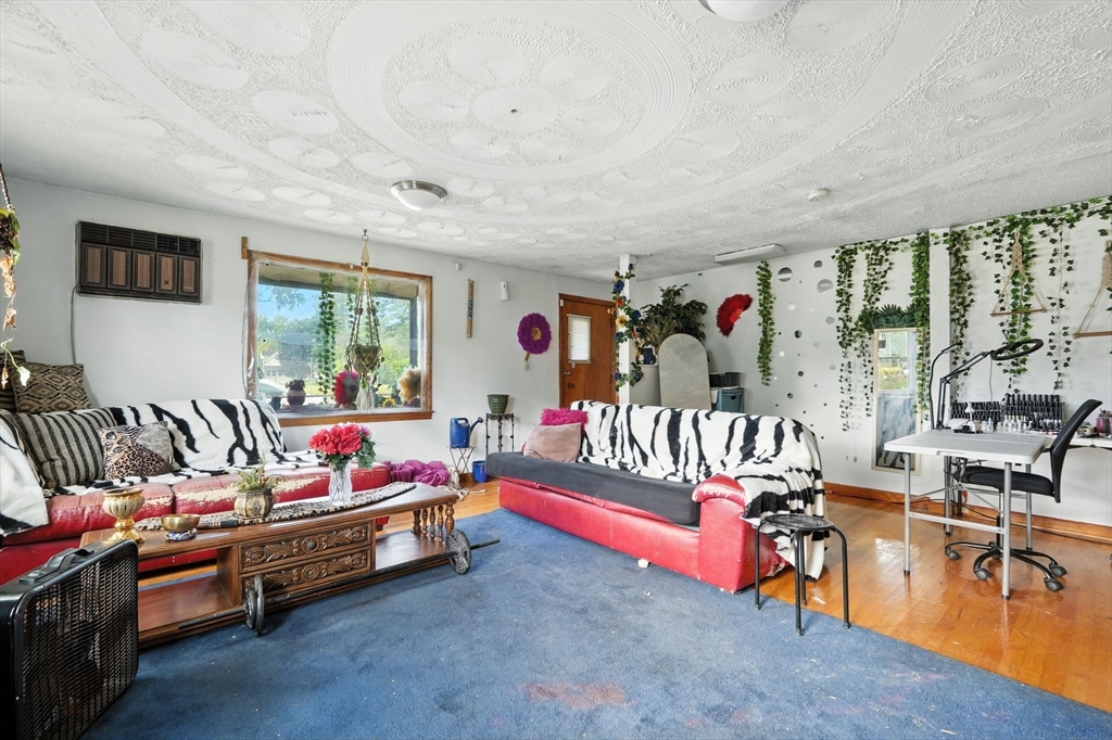 222-224 Main Street Springfield, MA 01151 - Photo 11 of 42 a bed room with furniture and a gym machine