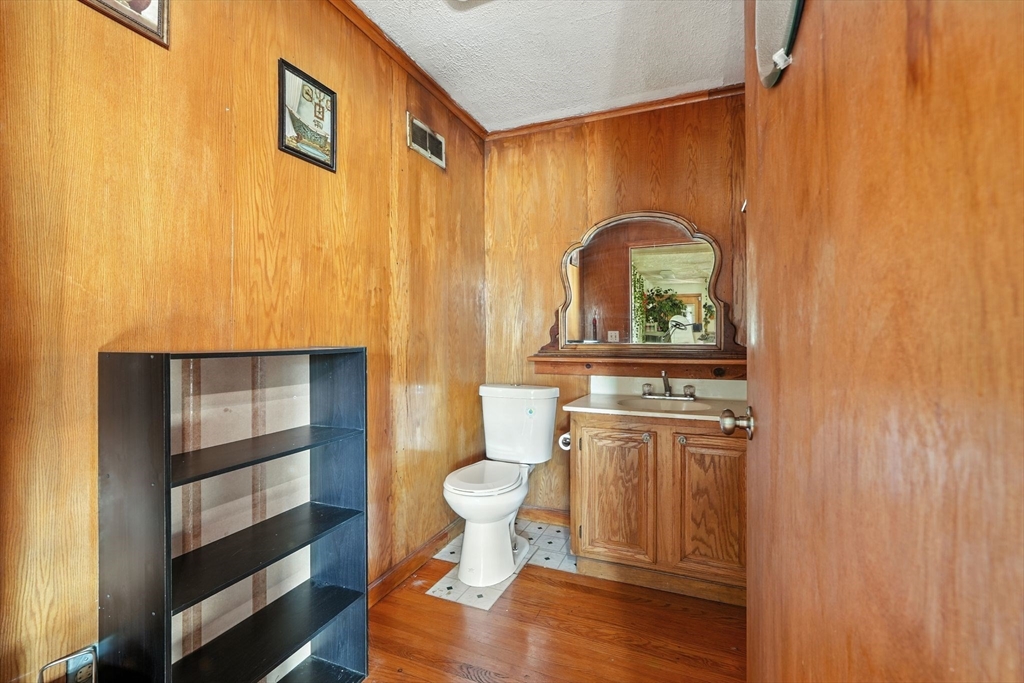 222-224 Main Street Springfield, MA 01151 - Photo 22 of 42 a room with a wooden floor and furniture