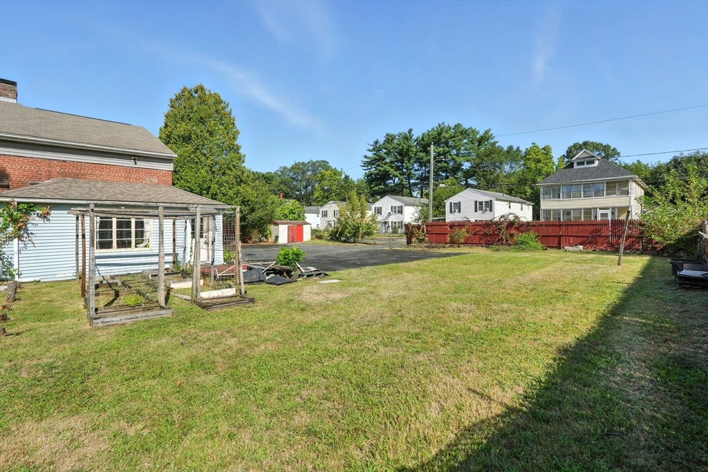 222-224 Main Street Springfield, MA 01151 - Photo 23 of 42 a house view with swimming pool and trees