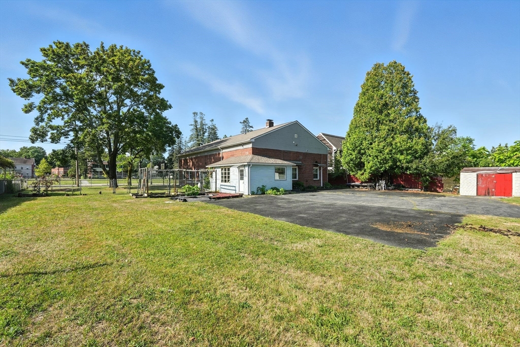222-224 Main Street Springfield, MA 01151 - Photo 26 of 42 a front view of a house with a yard