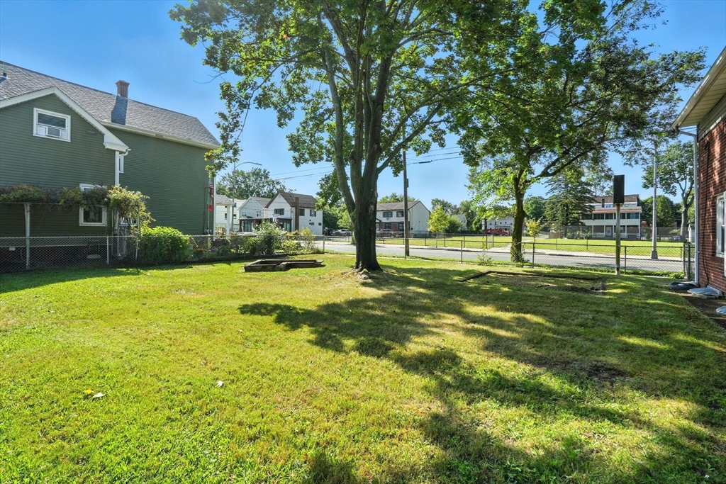 222-224 Main Street Springfield, MA 01151 - Photo 27 of 42 a swimming pool with outdoor seating and yard