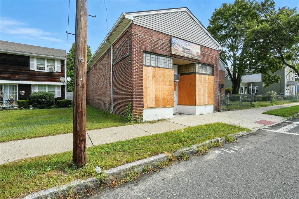 222-224 Main Street Springfield, MA 01151 - Photo 29 of 42 a front view of a house with a yard