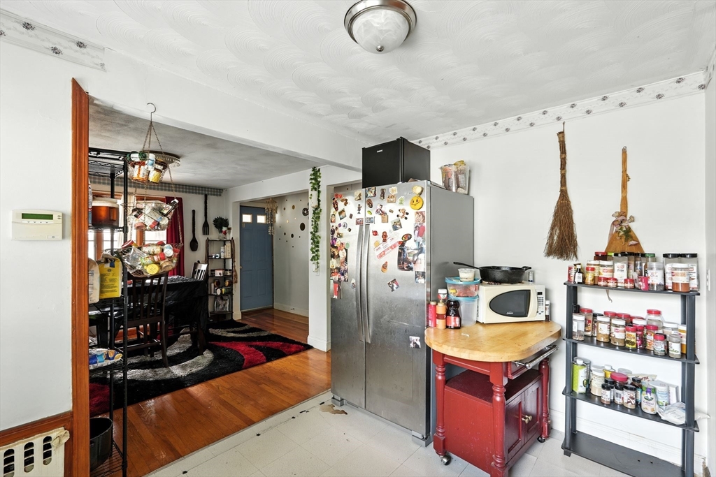 222-224 Main Street Springfield, MA 01151 - Photo 7 of 42 a view of a kitchen with refrigerator and workspace