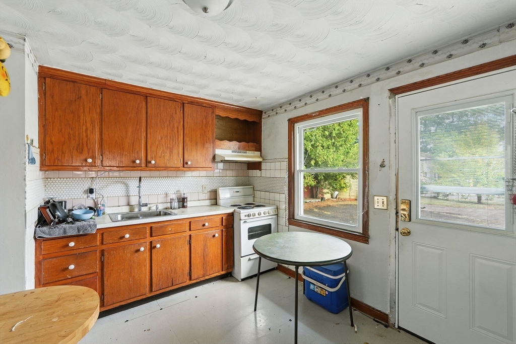 222-224 Main Street Springfield, MA 01151 - Photo 8 of 42 a kitchen with sink cabinets and window
