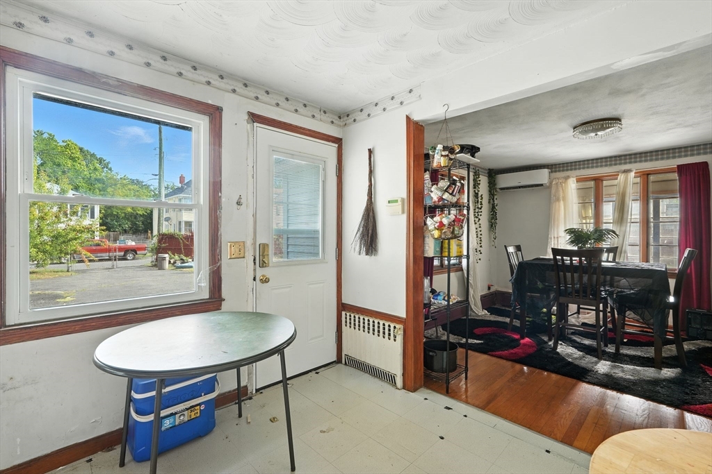 222-224 Main Street Springfield, MA 01151 - Photo 9 of 42 a living room with furniture a bookshelf and a window