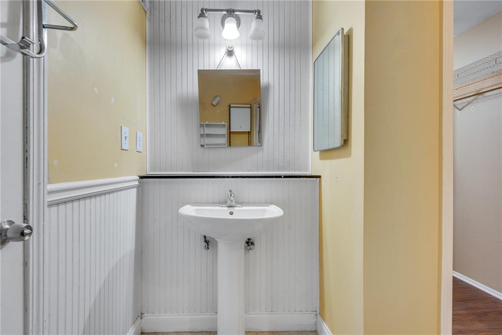 134 Lablanc Way Northwest Atlanta, GA 30327 - Photo 23 of 42 a bathroom with a sink and a mirror