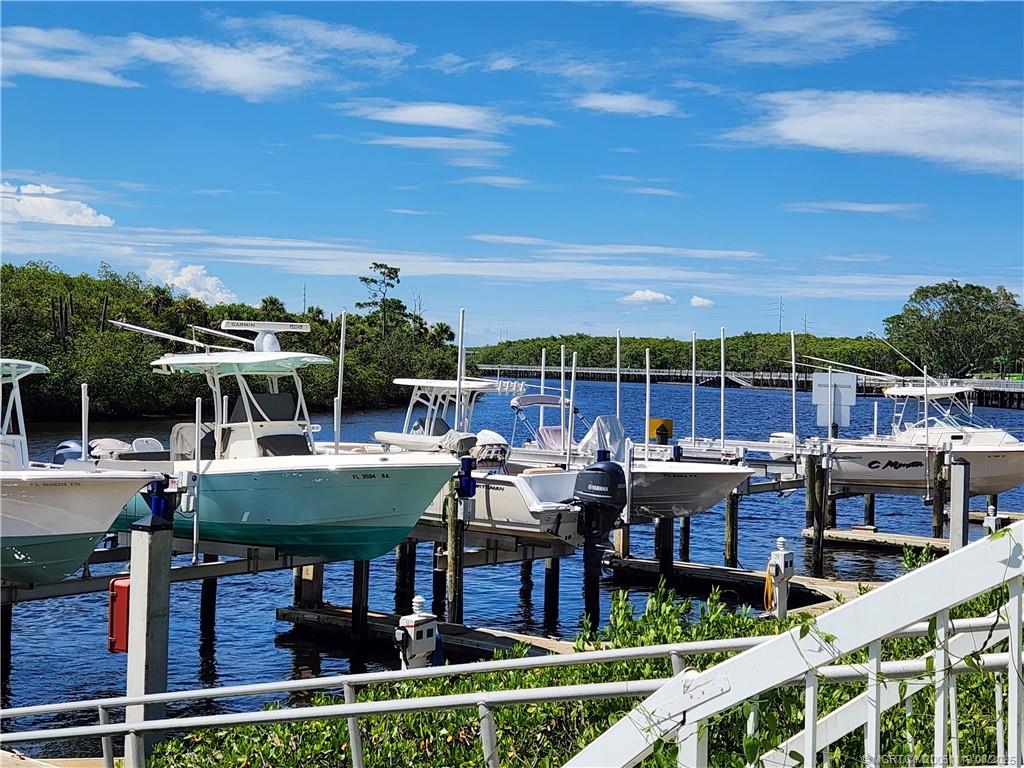 2502 Southeast Anchorage Cove, Unit H2 Port St. Lucie, FL 34952 - Photo 2 of 37 a view of a patio with couches chairs dining table and chairs